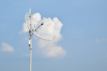 Outdoor internet wifi receiver and repeater installed on pole in long distant area of Thailand to receive signal from the wi-fi transmission tower and repeat it to the people's access points nearby.