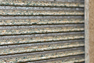 Oriented strand board. multi-layer sheet made of resin bonded wood chips. OSB texture. Materials for repair. Lumber. OSB sheets are stacked on top of each other. Building materials in store. 