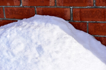 White fluffy snow in winter in a snowdrift