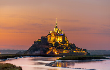 Mont Saint-Michel, France; July 24th 2020 - A view of Mont Saint-Michel at dusk, Normandy, France