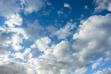 Naklejka na ściany i meble Clouds moving on blue sky forming a storm.