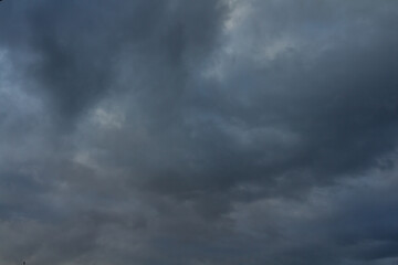 Dark stormy clouds moving on sky. Rain and hail.