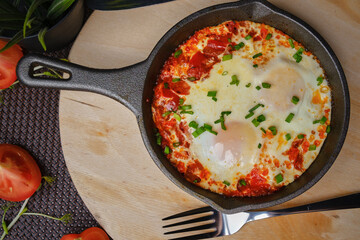 Omelet with tamat in a pan