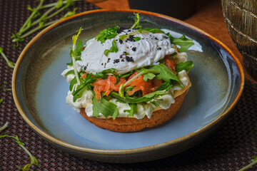 salmon and sandwich with poached egg on plate