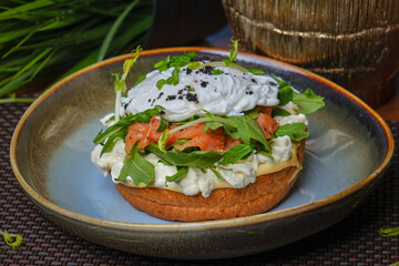 salmon and sandwich with poached egg on plate