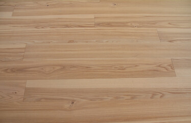 Natural oak wood laminate flooring background. Wood parquet flooring texture.