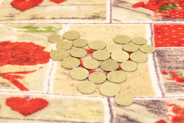 Heart-shaped silver coins background. Concept of making money - business and so on