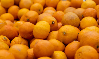 Lots of fresh orange fruits tangerines