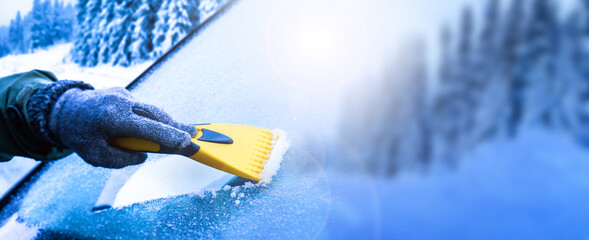 Clearing and remove snow from windshield, Scraping ice. Winter season car window cleaning. Copy...