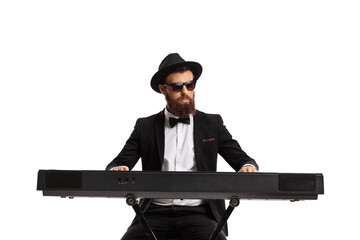 Bearded male musician playing a keyboard