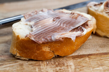 sliced white bread with sweet chocolate butter spread