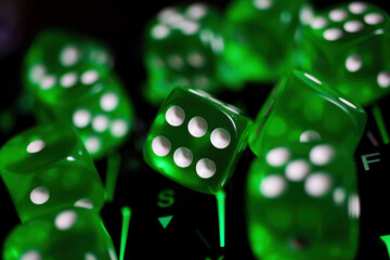 Makro closeup of group isolated green  dice cubes with face number 6 in center on illuminated...