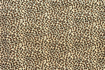 Schilderijen op glas Fleece warm synthetic fabric with leopard animal print © konoplizkaya