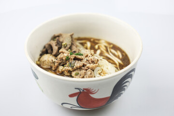 Thai boat noodles is Thailand's most famous noodles soup,Thai Boat noodles soup or Guay tiew reua ,Rice noodles thicken soup with stewed pork and pork ball, Braised pork and liver pork, 