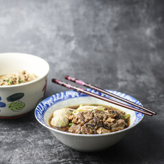 Thai boat noodles is Thailand's most famous noodles soup,Thai Boat noodles soup or Guay tiew reua ,Rice noodles thicken soup with stewed pork and pork ball, Braised pork and liver pork, 