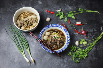 Thai boat noodles is Thailand's most famous noodles soup,Thai Boat noodles soup or Guay tiew reua ,Rice noodles thicken soup with stewed pork and pork ball, Braised pork and liver pork, 
