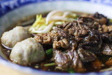 Thai boat noodles is Thailand's most famous noodles soup,Thai Boat noodles soup or Guay tiew reua ,Rice noodles thicken soup with stewed pork and pork ball, Braised pork and liver pork, 