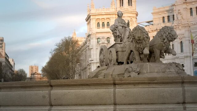 Cibeles Fountain At Plaza De Cibeles In Madrid, Spain, Europe In the evening. Tracking shot 