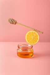 Equilibrium floating food balance with products honey and lemon for making drinks tea to prevent and treat colds and support the immune system. Alternative folk remedies medicine an anti-inflammatory