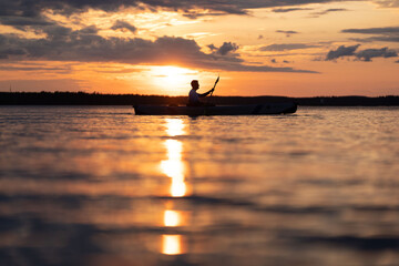 Kayaking in sunset 