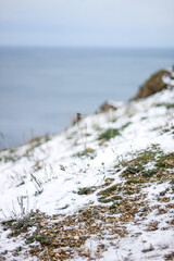 cliff in the snowy mountains by the sea. Black Sea.