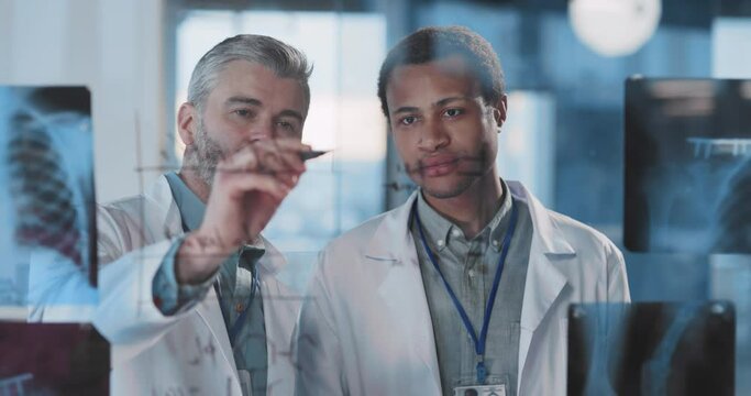 Adult medical couple doctor and african intern therapist cooperating in hospital office negotiating vaccine and conducting research. Teamwork. Healthcare.