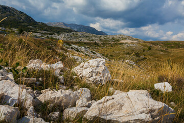 Country road with rocks in the mountains.
