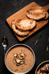 Mushroom cream soup served with toasted bread