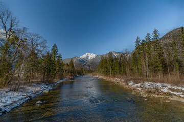 Koppentraum river near bridge with snowy hills and blue water