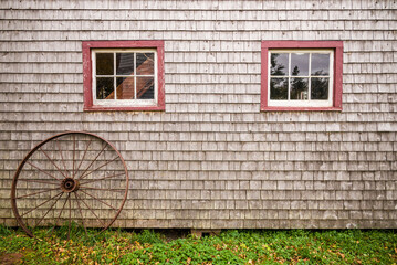Canada, Prince Edward Island, Orwell. Barn with old wagon wheel.