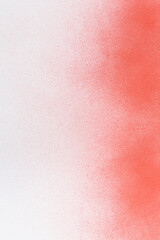 spray paint red on a white paper background