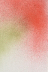 spray paint red and gree on a white paper background