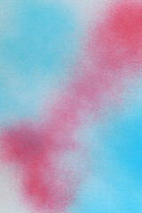 spray paint red and blue on a white paper background