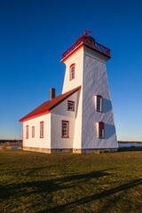 Fototapeta na wymiar Canada, Prince Edward Island, Wood Islands Lighthouse at sunset.