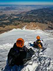 Group of mountaineers resting after summiting the Citlaltépetl - Pico de Orizaba in Mexico