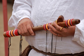 Cherokee Indian holding flute - obrazy, fototapety, plakaty