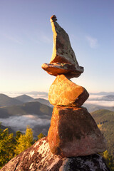 pyramid of stones at the top is a landart.