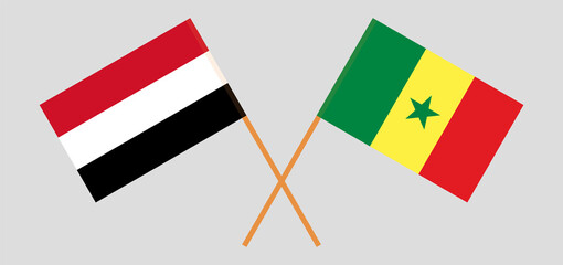 Crossed flags of Yemen and Senegal