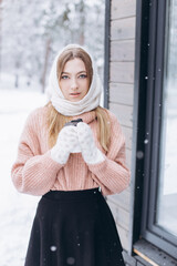 Beauty young blondie woman walking in winter park, smile and have fun outdoors