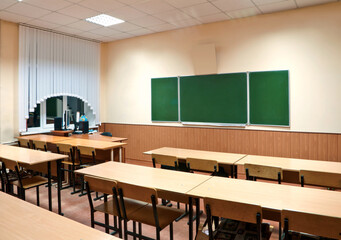class room with a school board and school desks