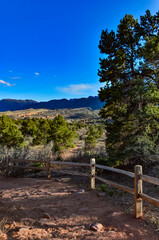 Fototapeta premium A wooden fence with a shadow from the sun, Garden of the Gods, US