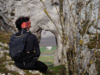 unrecognizable young hiker woman sitted in a mountain