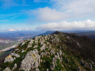 view of a valley from the top of a mountain in urbasa