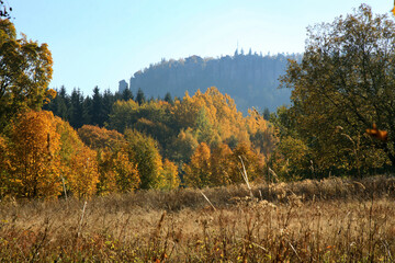 Autumn view on peak Stolowe Mountains from Pasterka village in Poland. Szczeliniec Wielki, Great...