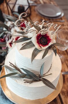 White Wedding Cake With Two Tiers With Flowers