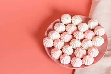 Sugar protein dessert in pastel colors in a pink plate on pink background. Linen napkin. Copy Space