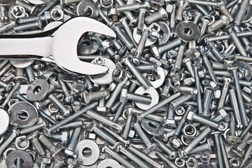 Chrome spanner, nuts and bolts useful as a background