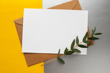 postcard mockup. blank white card with kraft brown paper envelope 
