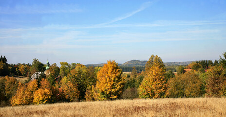 Fototapeta premium Autumn’s view on small picturesque village Pasterka in Table Mountains, Stolowe Mountains in Poland. Europe. 