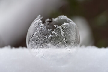 wintry broken frozen soap bubble